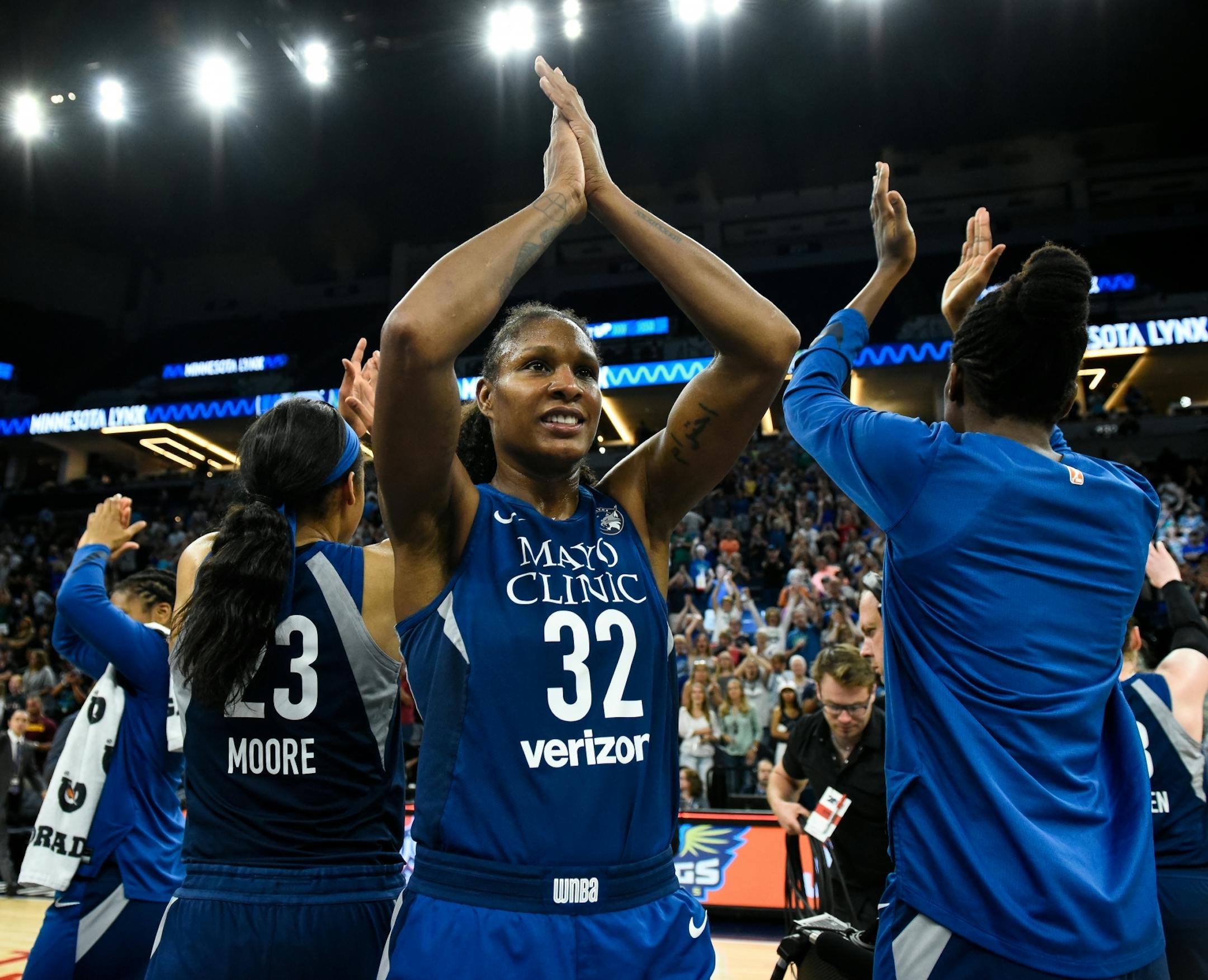 Minnesota Lynx forward Rebekkah Brunson (32) celebrated with her team following their 83-72 win against the Los Angeles Sparks.