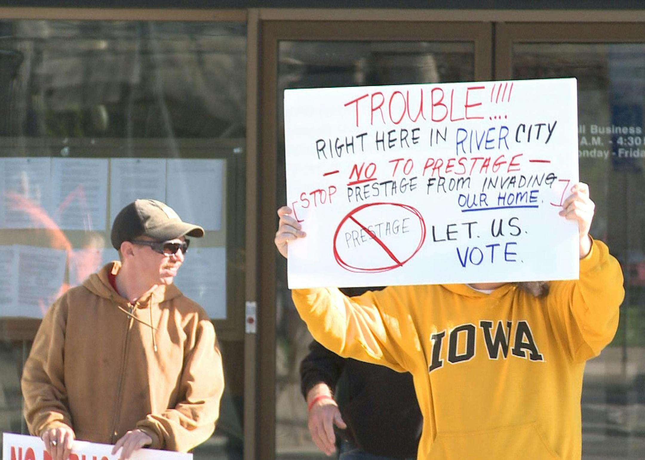 Caption: Protesters rallied against the proposed Prestage pork plant in Mason City. Credit: KIMT News 3