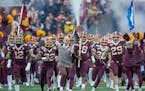 Gophers Coach P. J. Fleck led his team onto the field before a game last November.