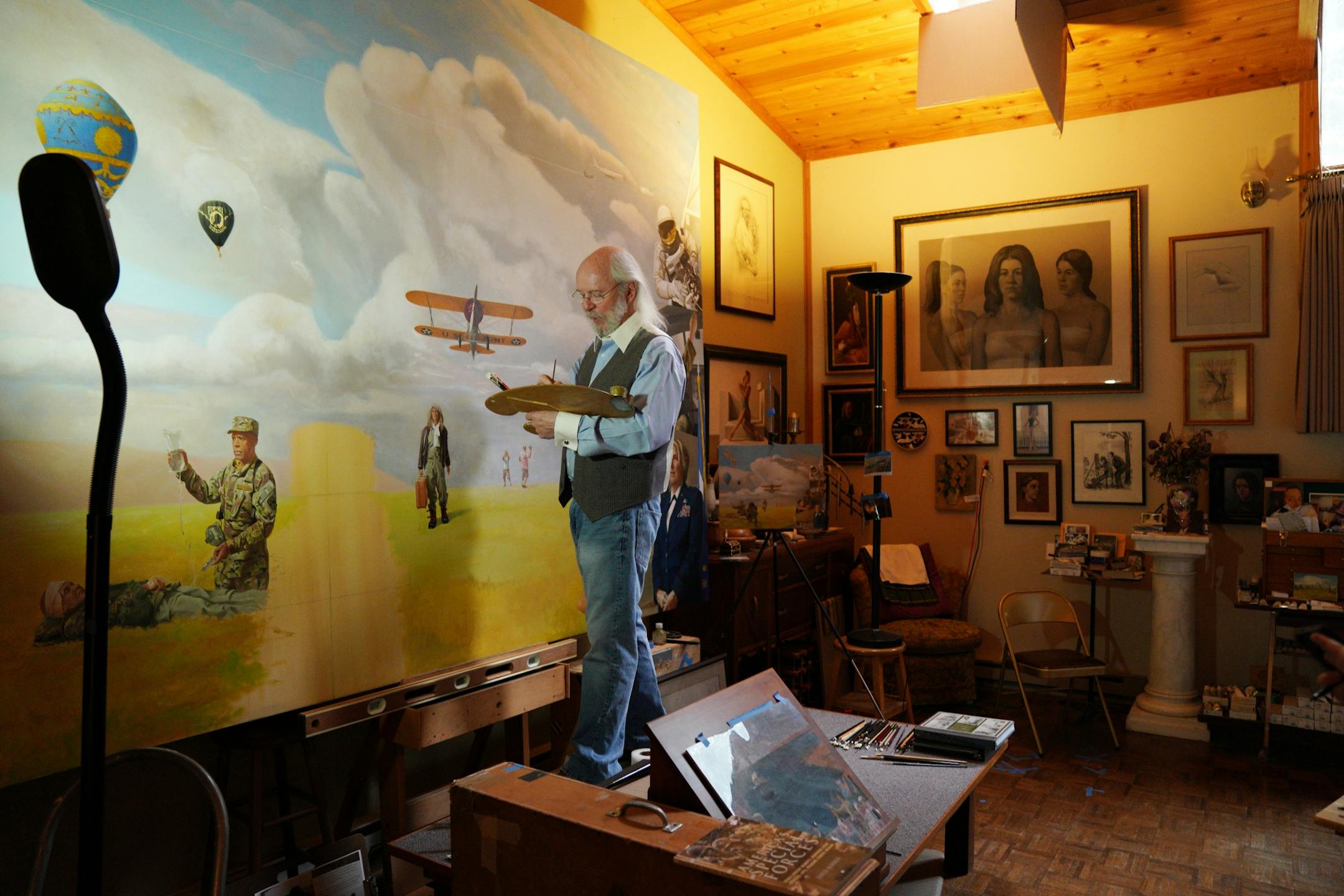Classically trained Italian fresco painter Charles Gilbert Kapsner worked on the last of five murals for his 10-year U.S. war veterans project at his studio in Little Falls.