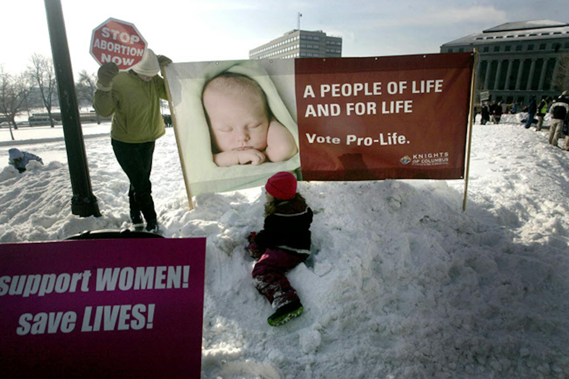 Julie Knapp, of Maplewood, joined by her daughter Monica, 6, found a quiet spot to protest Roe v. Wade today at the State Capital.