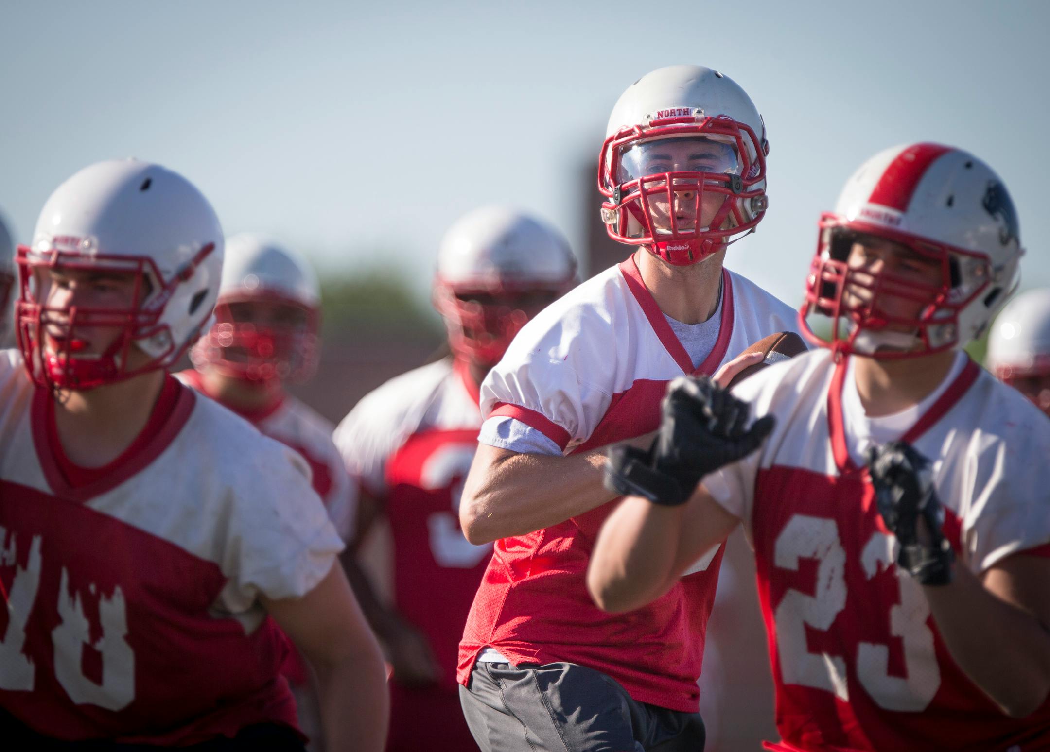 Quarterback Drew Stewart looked for someone to pass to during football practice in August 2015 at Lakeville North High School.