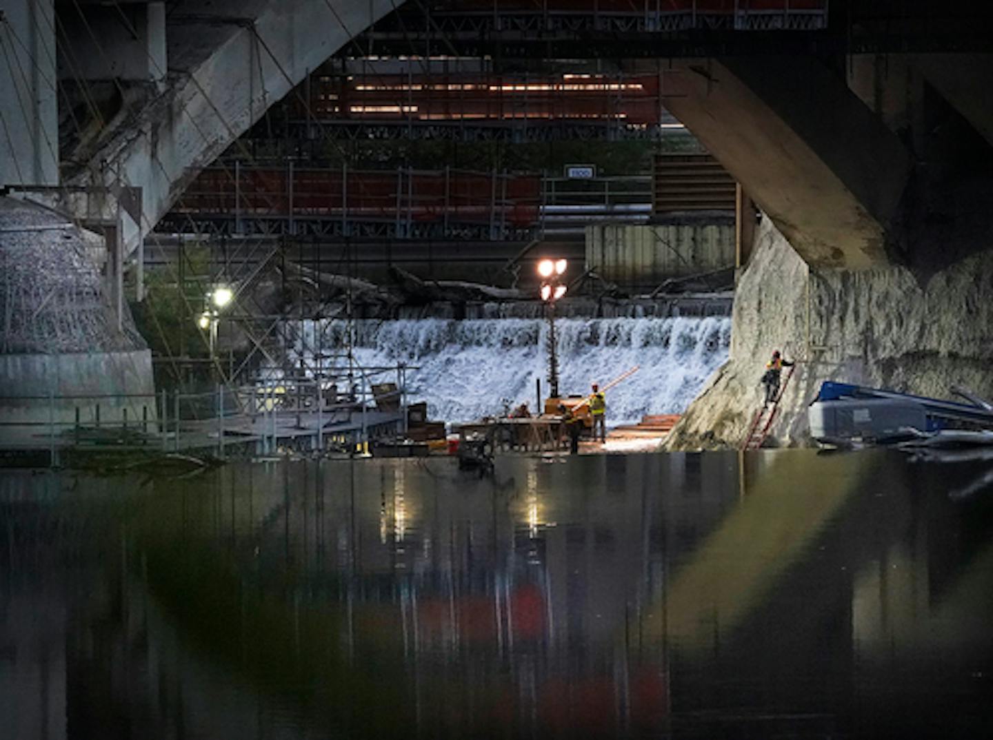 Work continues on Third Avenue Bridge project over the Mississippi River. The 100 plus year-old bridge has been closed to traffic since Jan. 2021 and the nearly $130 million renovation is expected to be completed at the end of 2022 and seen Friday in Minneapolis. ]