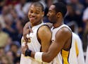 Kobe Bryant "took me under his wing," said Devean George, left, the Minneapolis native who won championships with the Lakers alongside Bryant.
