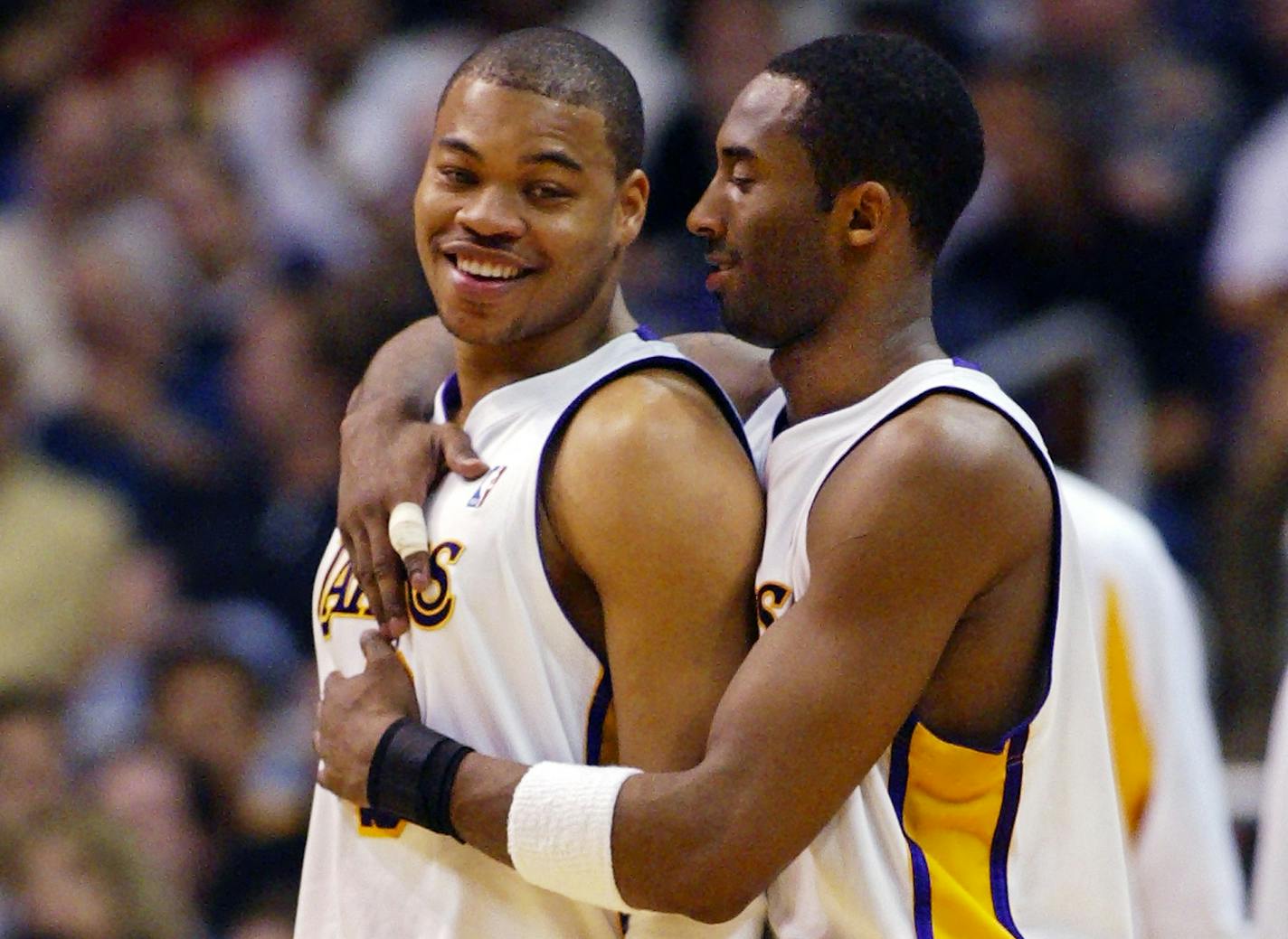 Kobe Bryant "took me under his wing," said Devean George, left, the Minneapolis native who won championships with the Lakers alongside Bryant.