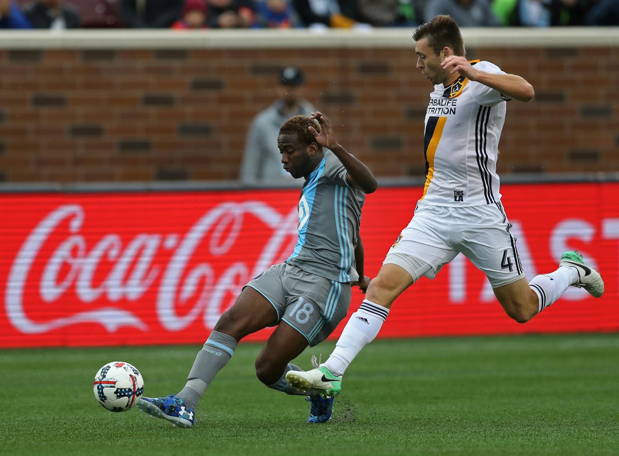 Minnesota United's Kevin Molino, left, fought for control against Los Angeles' Dave Romney at TCF Bank Stadium on Sunday. The Loons had control of the ball 65.5 percent of the match, yet still came away with a 2-1 loss to the Galaxy, falling to ninth in the Western Conference at 3-7-2.