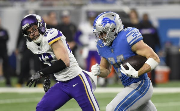 Minnesota Vikings free safety Harrison Smith (22) chases Detroit Lions running back Zach Zenner (34) during the first half of an NFL football game, Su