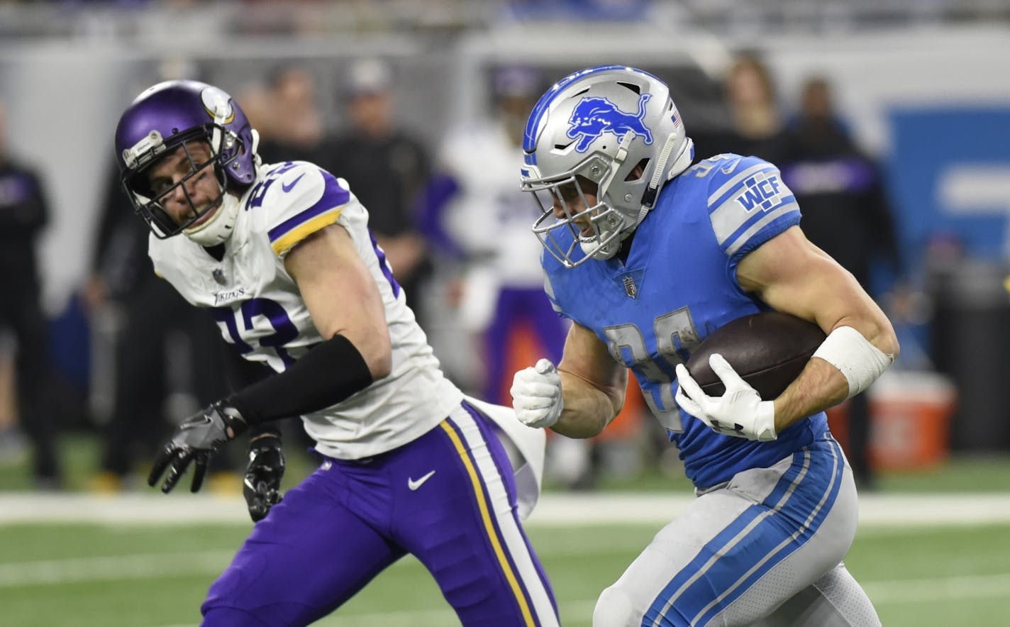 Minnesota Vikings free safety Harrison Smith (22) chases Detroit Lions running back Zach Zenner (34) during the first half of an NFL football game, Sunday, Dec. 23, 2018, in Detroit.