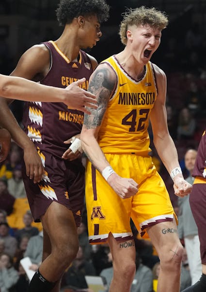 Minnesota Golden Gophers center Treyton Thompson (42) reacts to being fouled and making the basket in Minneapolis, Minn., on Thursday, Nov. 17, 2022. 