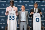 Wolves executive Tim Connelly, middle, posed with draft picks Leonard Miller and Jaylen Clark on June 26, 2023.
