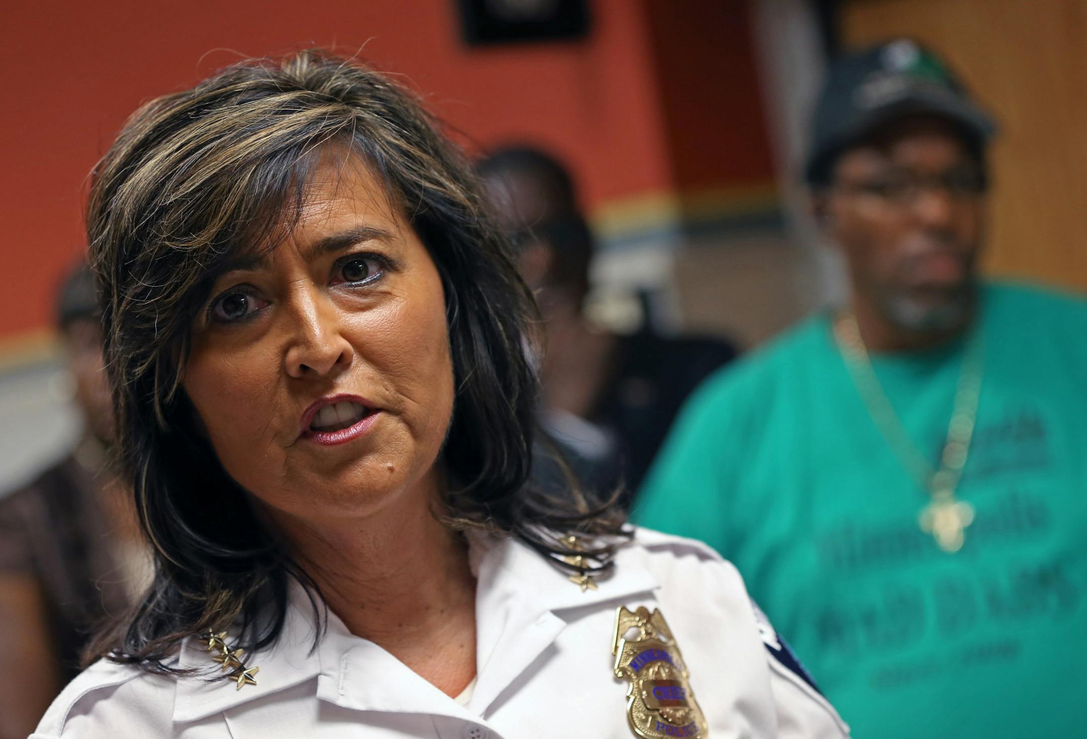 (left) Minneapolis Police Chief Janee Harteau talked to the media after she held a closed door meeting with community leaders on how to improve community relations with the police deptment. This is in response to recent incidents in Green Bay involving Minneapoils cops. The meeting was held at Harteau's office in city hall on 8/7/13.] Bruce Bisping/Star Tribune bbisping@startribune.com Janee Harteau/source.