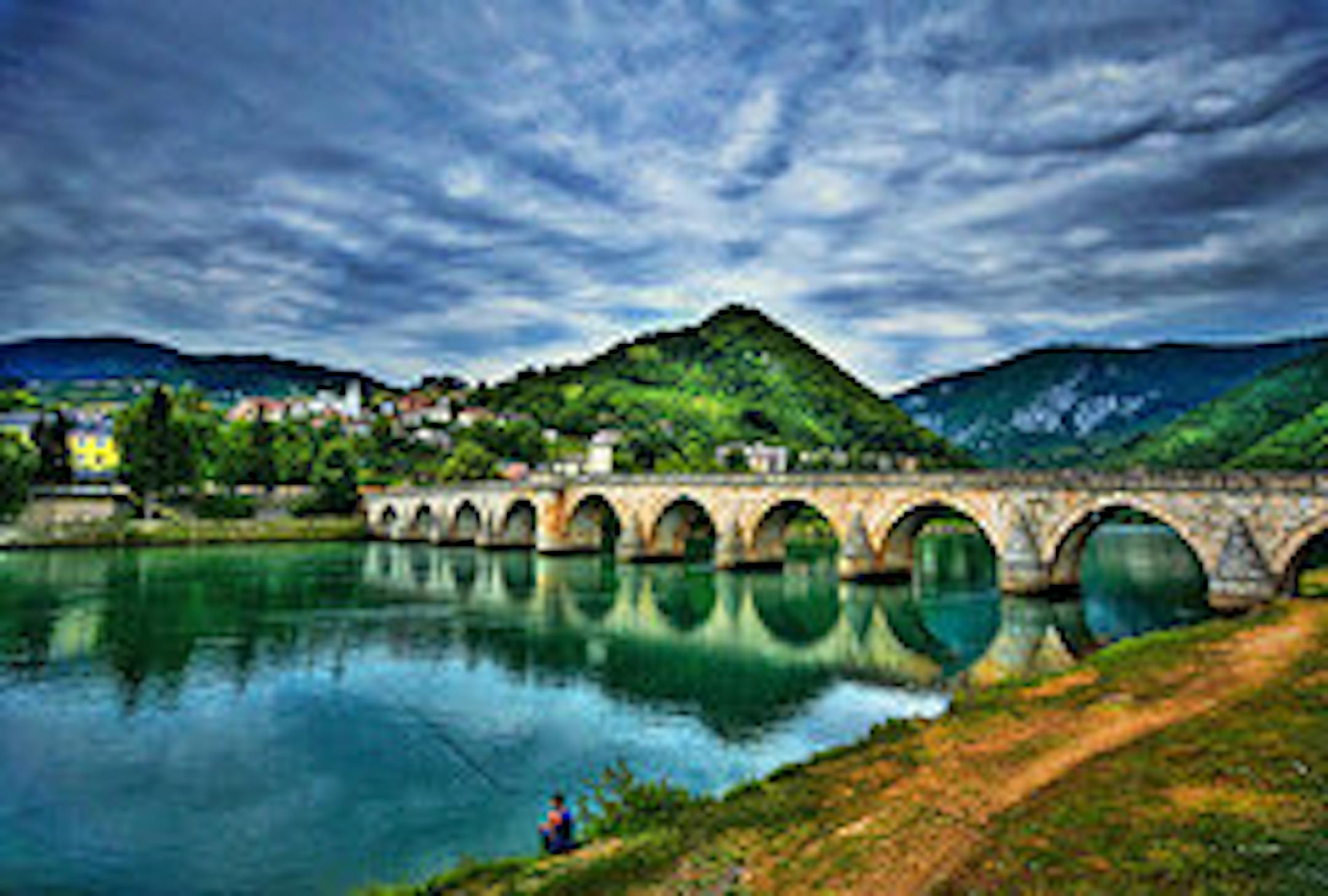 "Sunday Afternoon Fishing," a manipulated photograph of a bridge over the Drina River in Bosnia-Herzegovina.