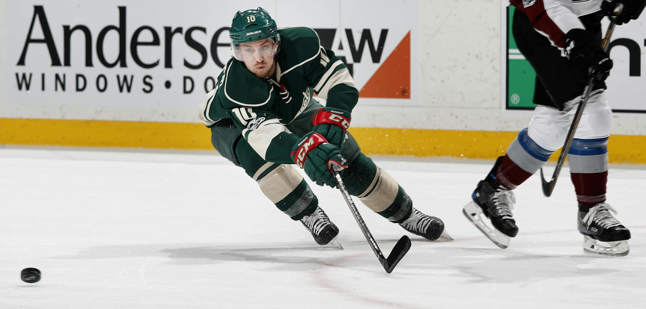 Jordan Schroeder (10) chased the puck in the first period.