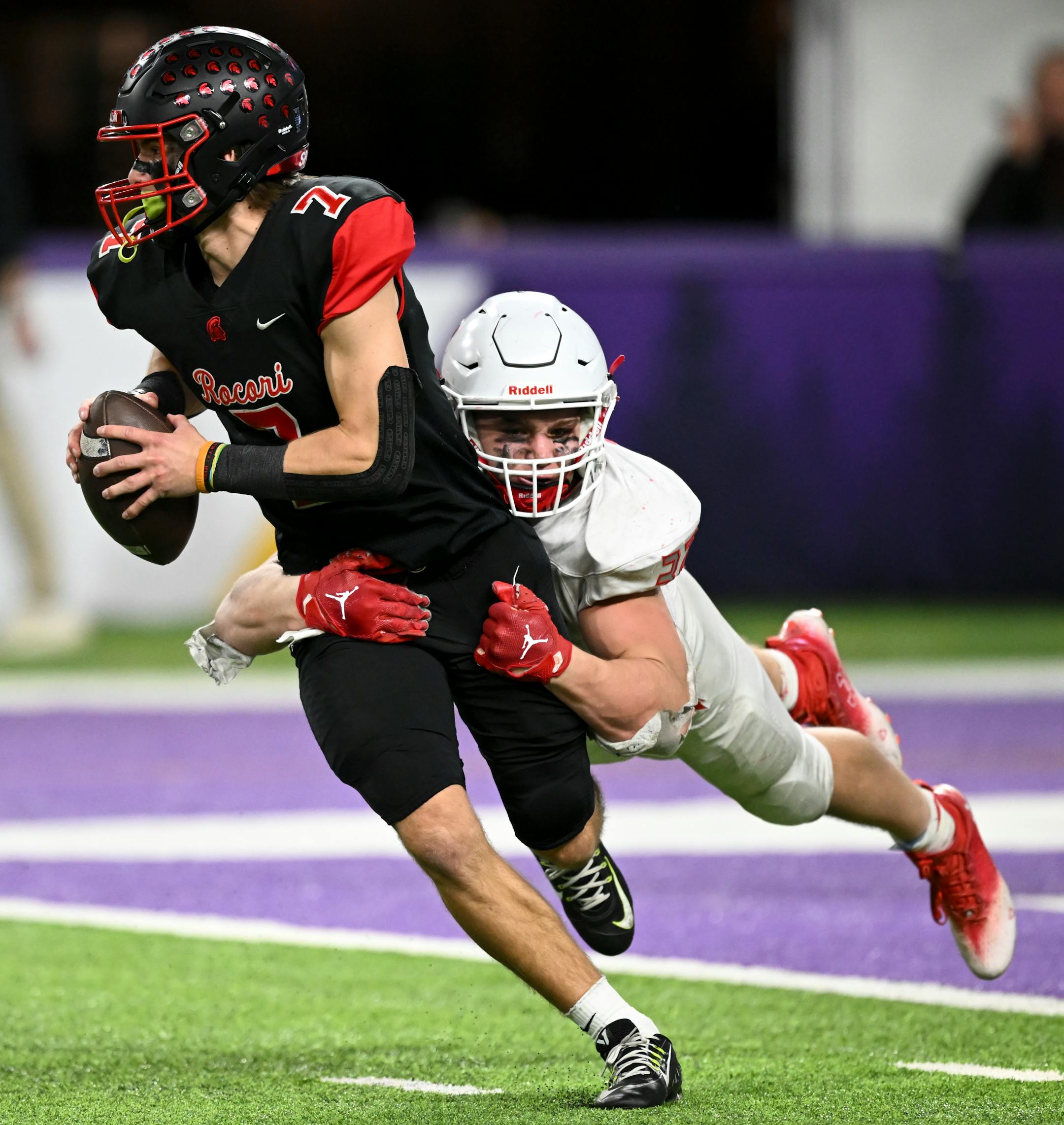 Rocori Quarterback Jack Spanier (7) is sacked by Simley linebacker Gavin Nelson (32) during the second half.
