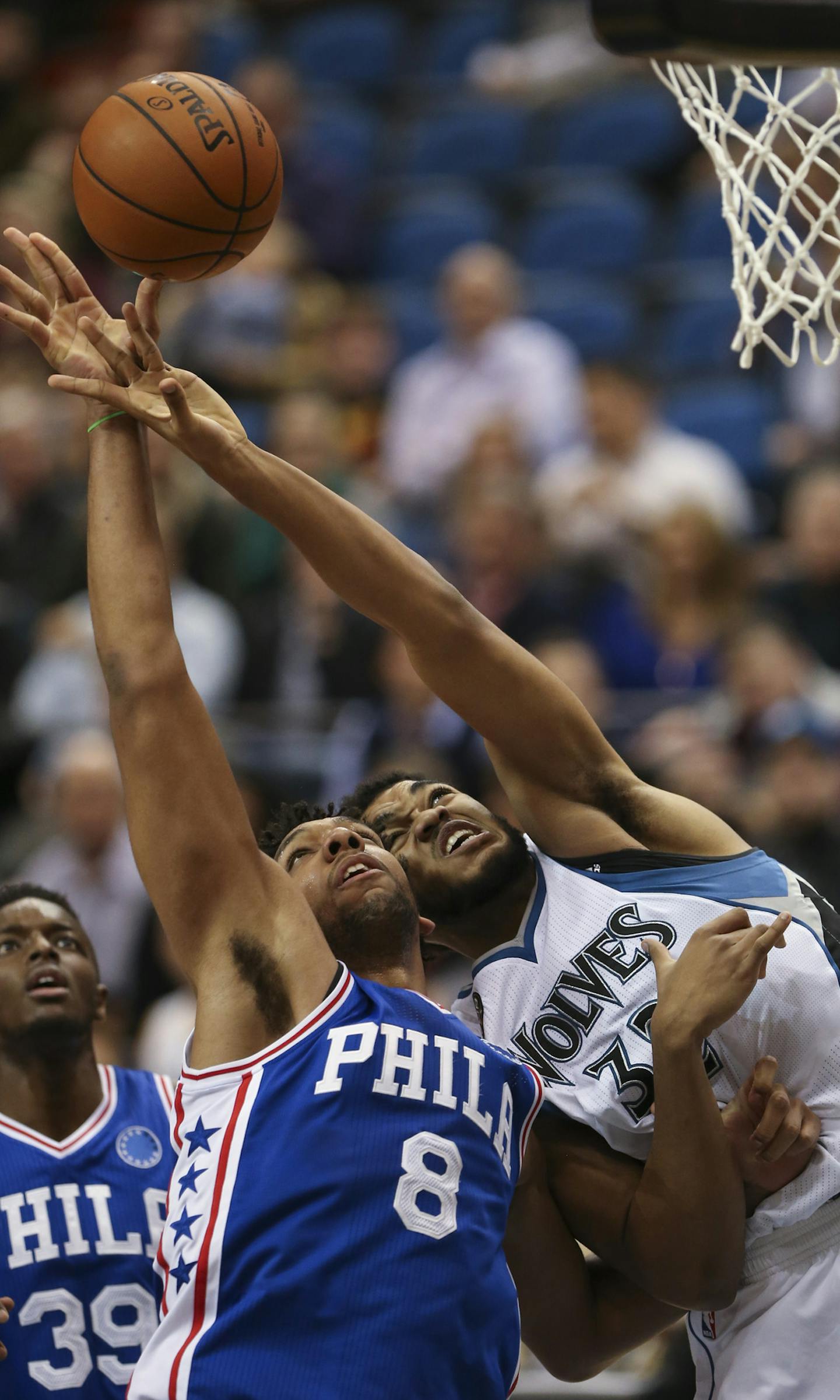 Timberwolves center Karl-Anthony Towns (32) fouled Philadelphia 76ers center Jahlil Okafor (8) as they were going for a rebound under the Wolves' net in the second quarter Monday night. ] JEFF WHEELER &#xef; jeff.wheeler@startribune.com The Minnesota Timberwolves met the Philadelphia 76ers Monday night, November 23, 2015 at Target Center in Minneapolis.