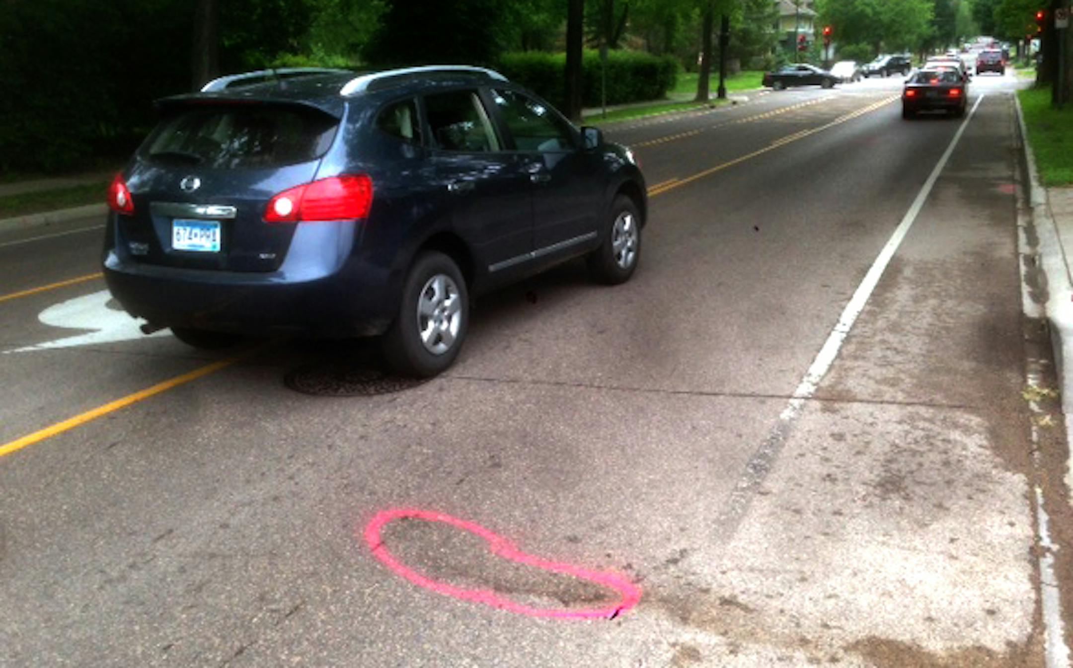 Authorities investigating the fatal collision between a skateboarder and a vehicle left markers on the pavement near the scene at Grand and Fairview Avenues in St. Paul, authorities said.