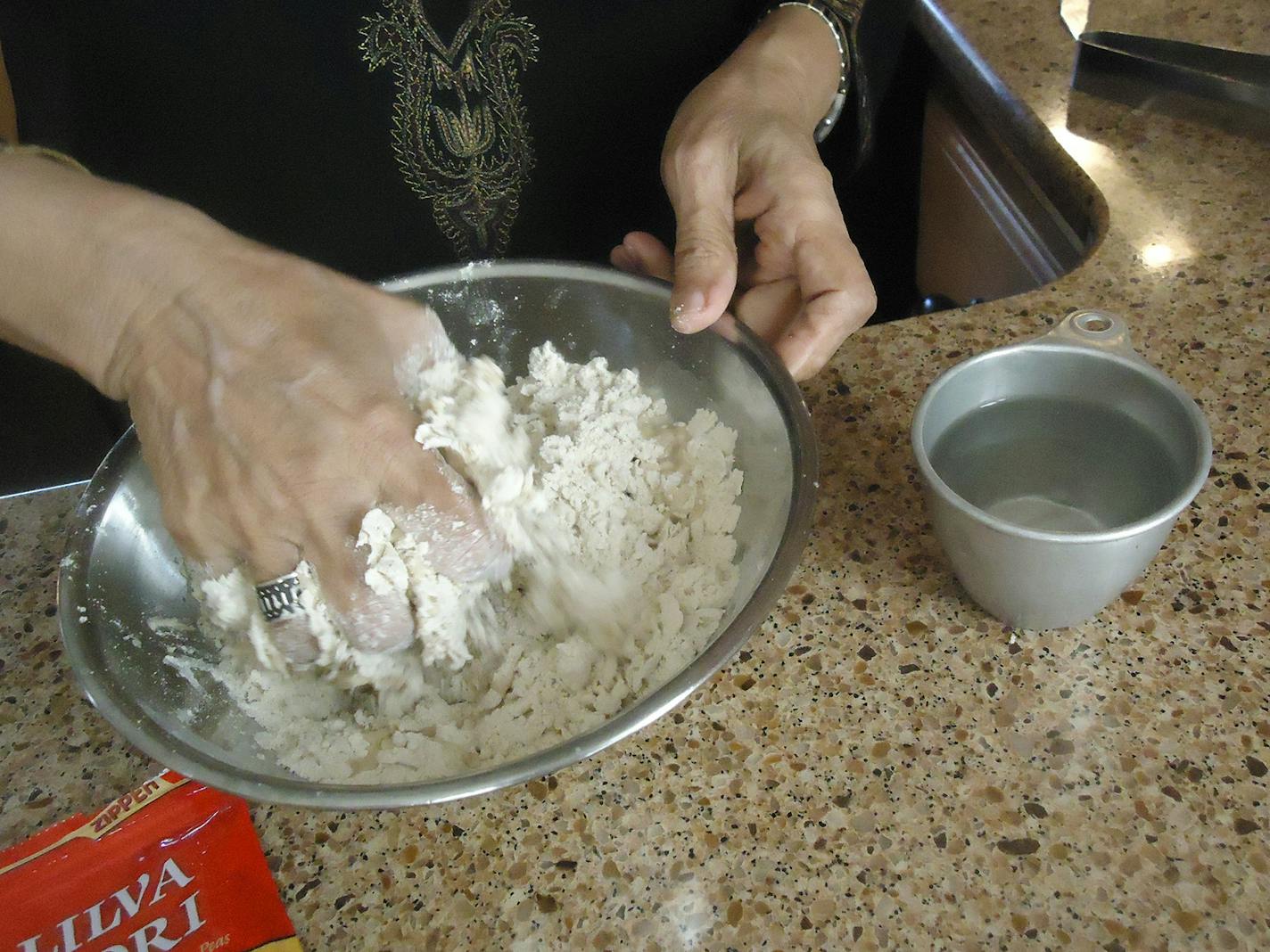 The simple dough &#x2014; just flour, water, oil and salt &#x2014; is mixed by hand until just craggy.