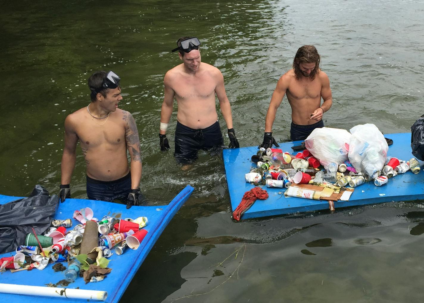 Submitted photos from Gabriel Jabbour, owner of Tonka Bay Marina, of volunteers diving this month (July 2015) to pick up trash in Lake Minnetonka near Big Island.