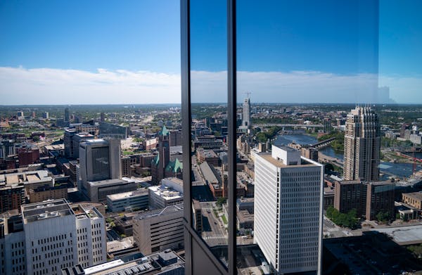 The Minneapolis skyline is reflected on the RBC Gateway tower. Steve Cramer, chief executive of the Minneapolis Downtown Council, said plans to bring 
