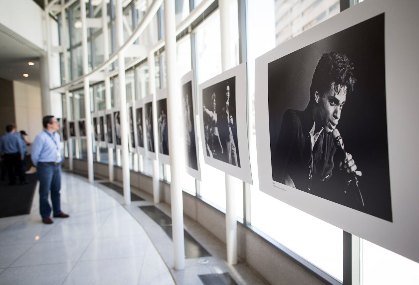 Passersby perused a gallery of Prince photos from the Star Tribune archives.