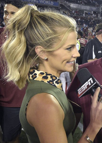 ESPN sideline reporter Samantha Ponder, left, interviews Florida State head coach Jimbo Fisher, center, as his son Ethan Fisher, right, watches after 