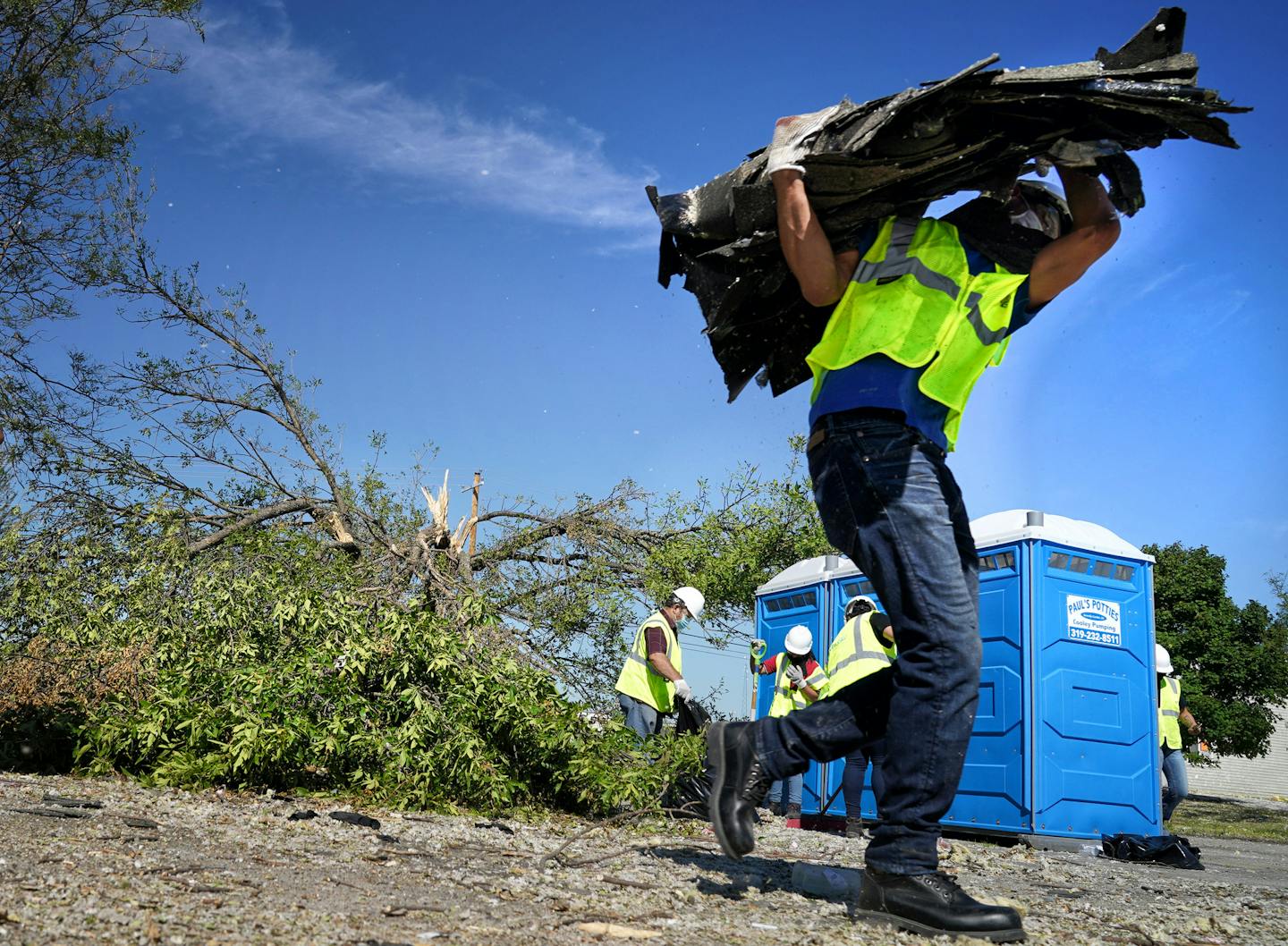 Neighbors, volunteers and contract workers from Blue Sky Restoration cleaned up debris from Monday's derecho that ripped through Cedar Rapids. Derecho storm devastation in Cedar Rapids Iowa, with 130,000 residents the state's second-largest city. The "inland hurricane" last week wiped out half the city's tree canopy and a week later, thousands are still homeless and without power. ] GLEN STUBBE • glen.stubbe@startribune.com Tuesday, August 18, 2020 Derecho storm devastation in Cedar Rapids Iowa,