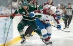 Jordan Greenway (18) of the Minnesota Wild and Samuel Girard49) of the Colorado Avalanche chased the puck in the first period.