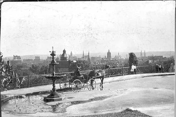 A man and horse took in a view of St. Paul from Merriam outlook circa 1895.