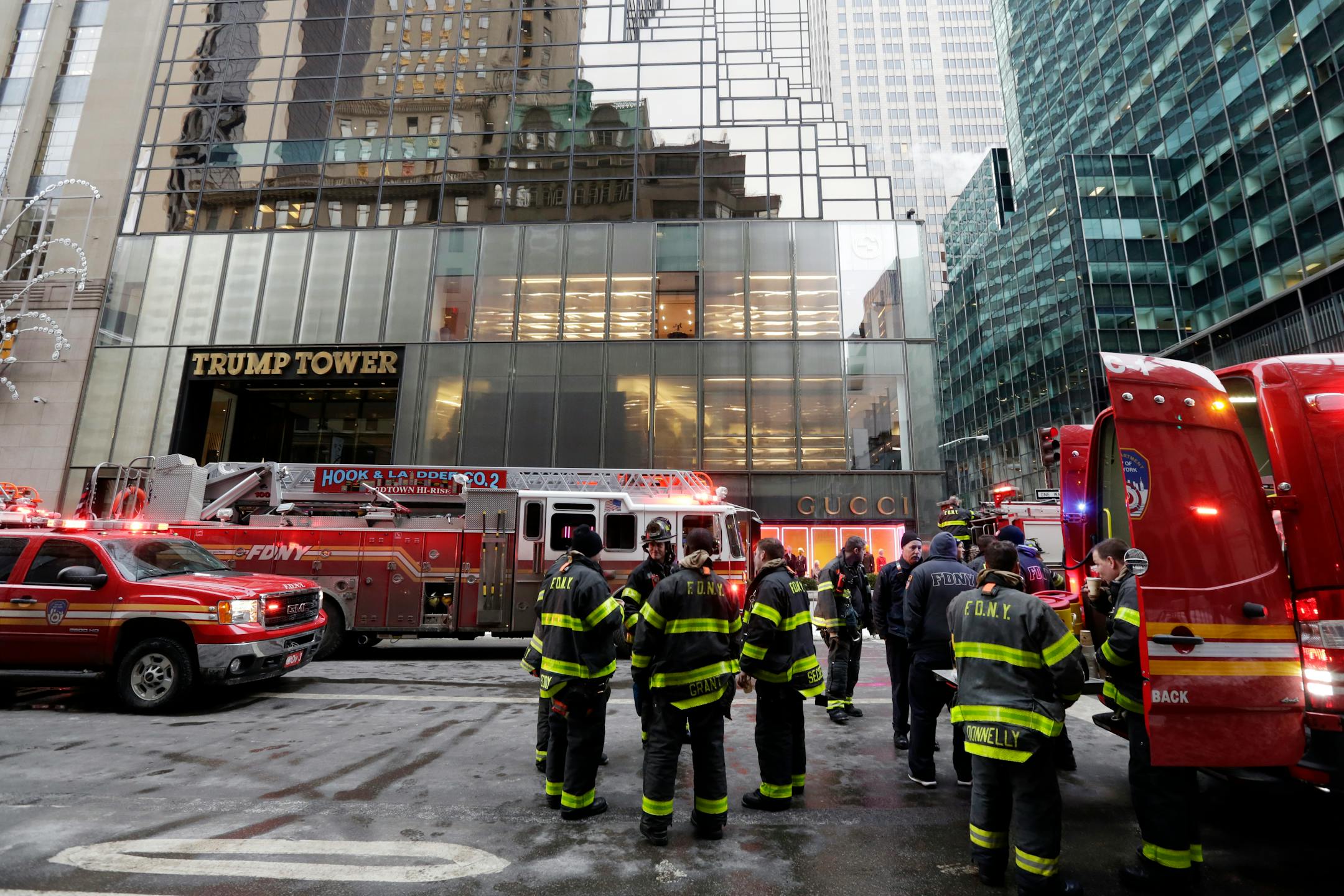 New York City Fire Department vehicles sit on Fifth Avenue in front of Trump Tower, in New York, Monday, Jan. 8, 2018. The department says the fire started around 7 a.m. Monday in the heating and air conditioning system of the building on Fifth Avenue in Manhattan. (AP Photo/Richard Drew)