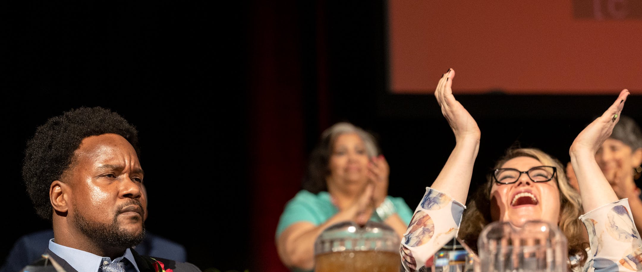 Teacher of the Year finalist Molly Megan Keenan, right, reacts after Michael Houston left, a mathematics teacher at Harding High School in St. Paul Public Schools, is named 2023 Minnesota Teacher of the Year on Sunday, May 7, 2023, at The River Center in St. Paul, Minn.