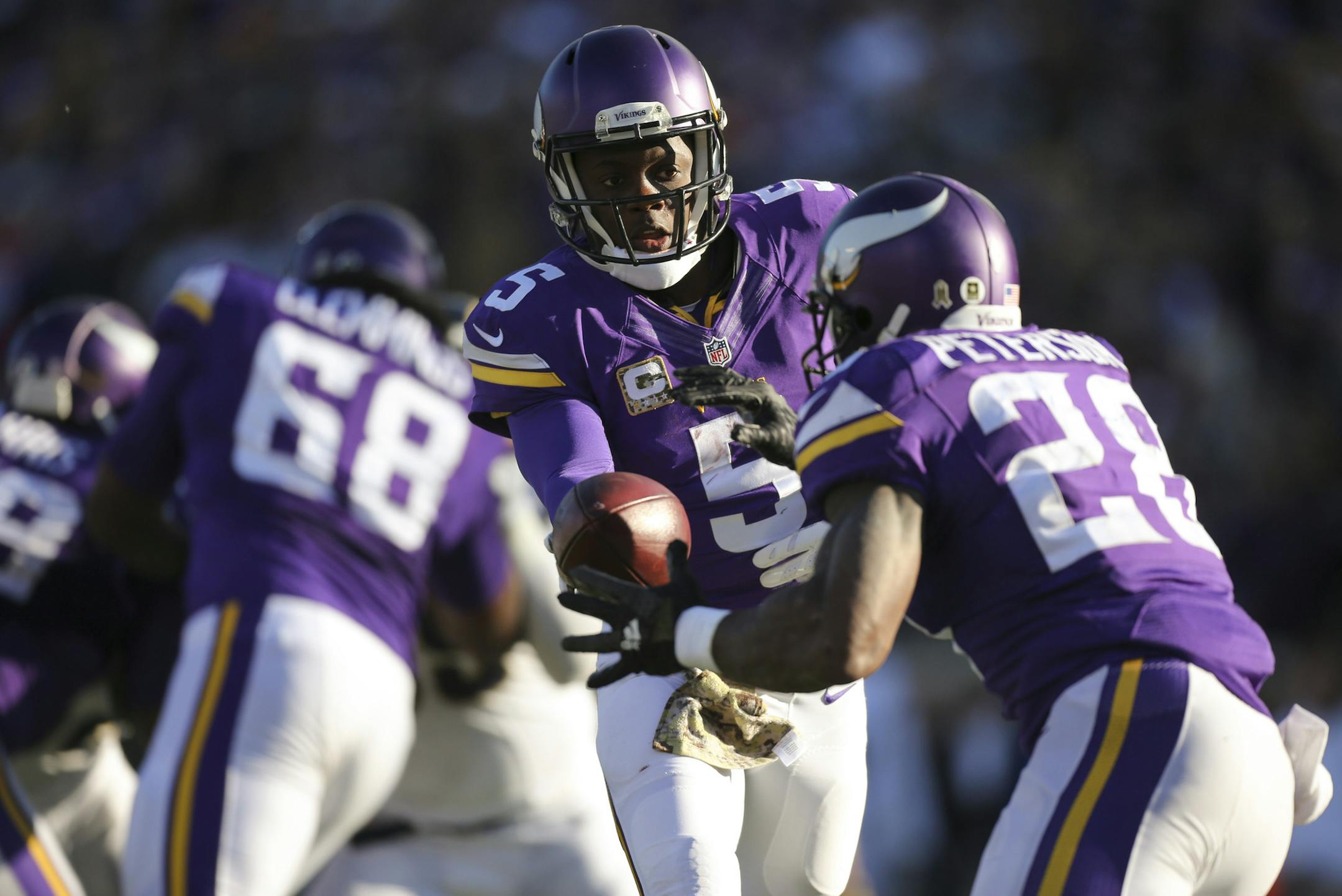 Vikings quarterback Teddy Bridgewater handed off to Vikings running back Adrian Peterson in the third quarter Sunday afternoon. ] JEFF WHEELER &#xef; jeff.wheeler@startribune.com The Minnesota Vikings beat the St. Louis Rams 21-18 in overtime on a 40 yard Blair Walsh field goal Sunday afternoon, November 8, 2015 at TCF Bank Stadium in Minneapolis.