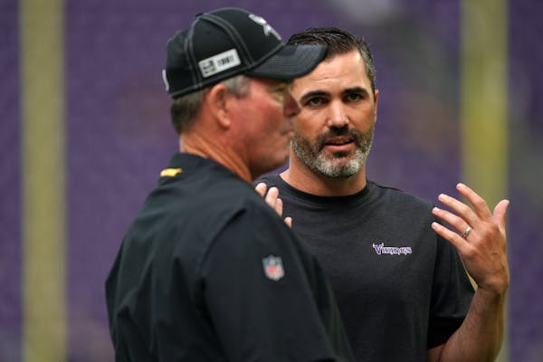 Vikings head coach Mike Zimmer with then-offensive coordinator Kevin Stefanski in 2019. Zimmer and Stefanski will be on opposite sidelines on Sunday.
