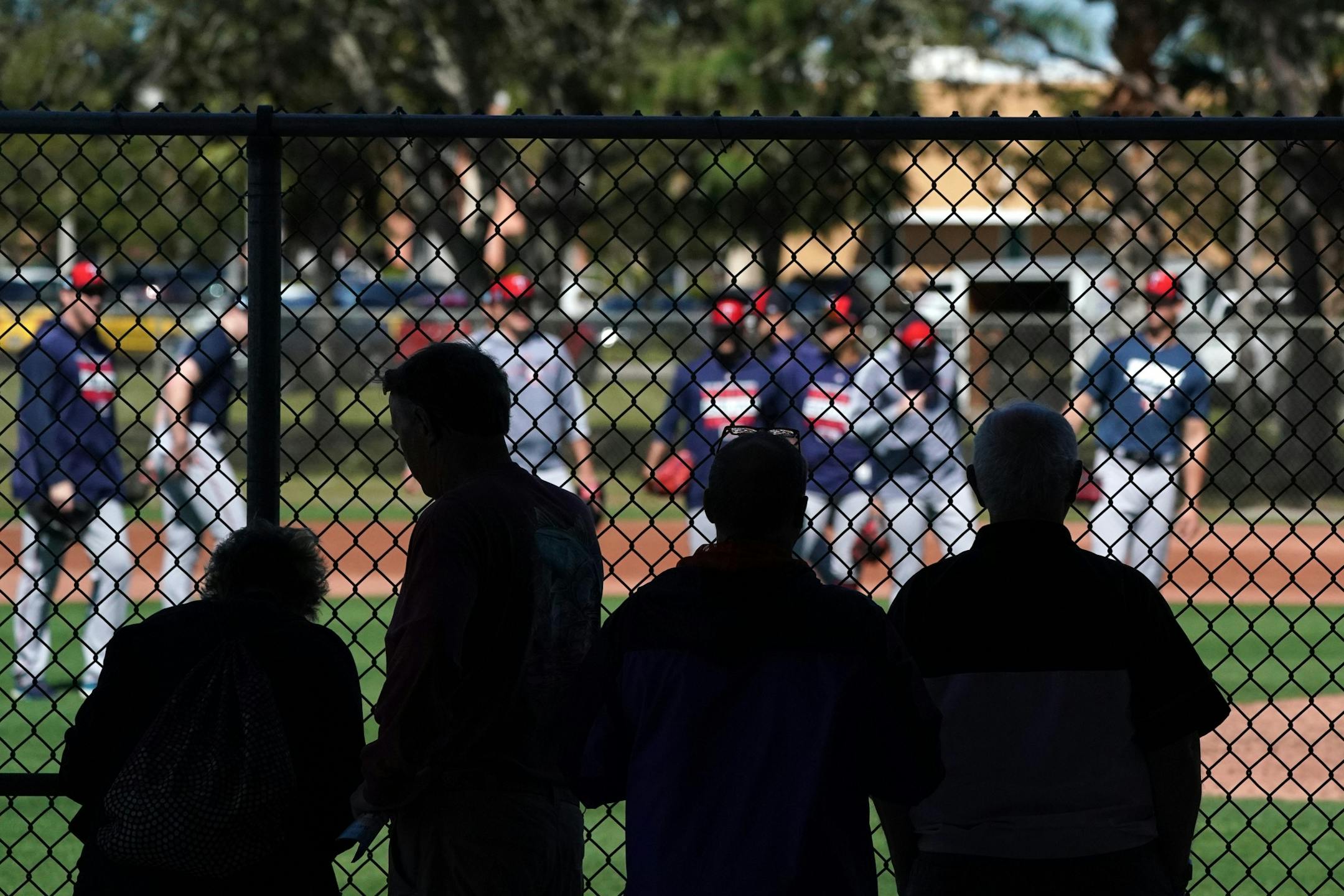 Fans watched from the shade as pitchers worked out on the half field behind Hammond Stadium Thursday morning.