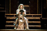 Tyler Michaels King as Richard II faces himself in a mirror in the Guthrie Theater's 2024 production of Shakespeare's history play.