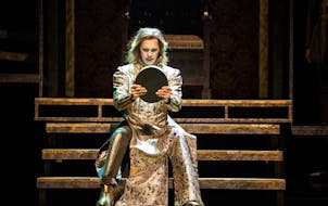 Tyler Michaels King as Richard II faces himself in a mirror in the Guthrie Theater's 2024 production of Shakespeare's history play.