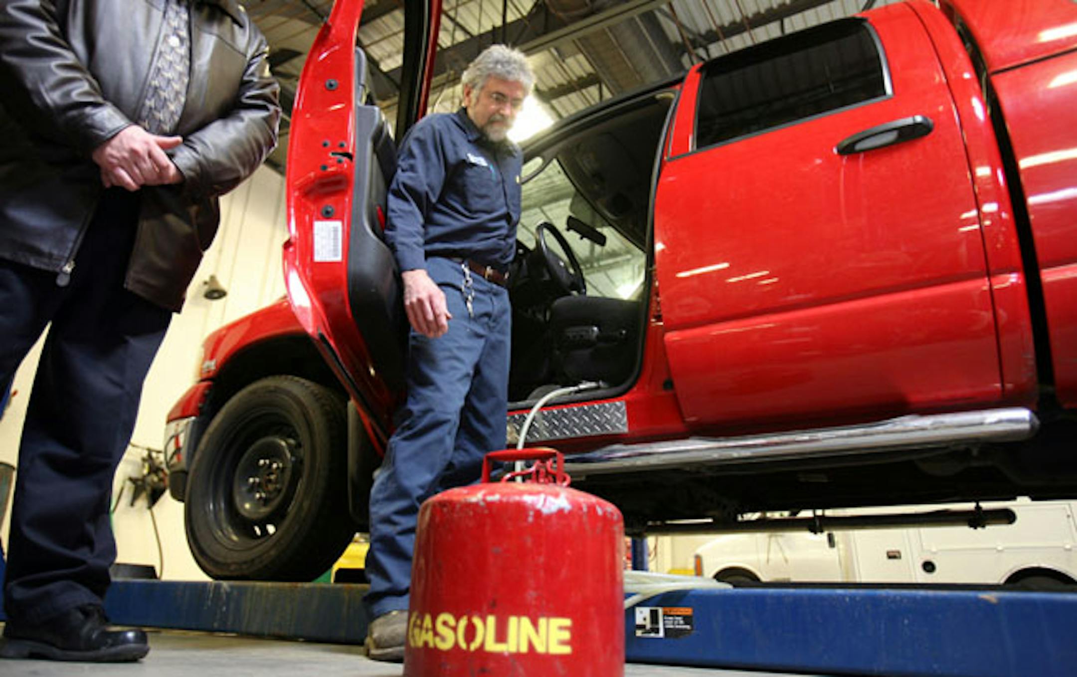 Jack Michaud, general supervisor of Ramsey County Public Works maintenance department, demonstrated how an elaborate system of hoses and switches on this truck was used to siphon gas from an adjacent car while the driver waited.
