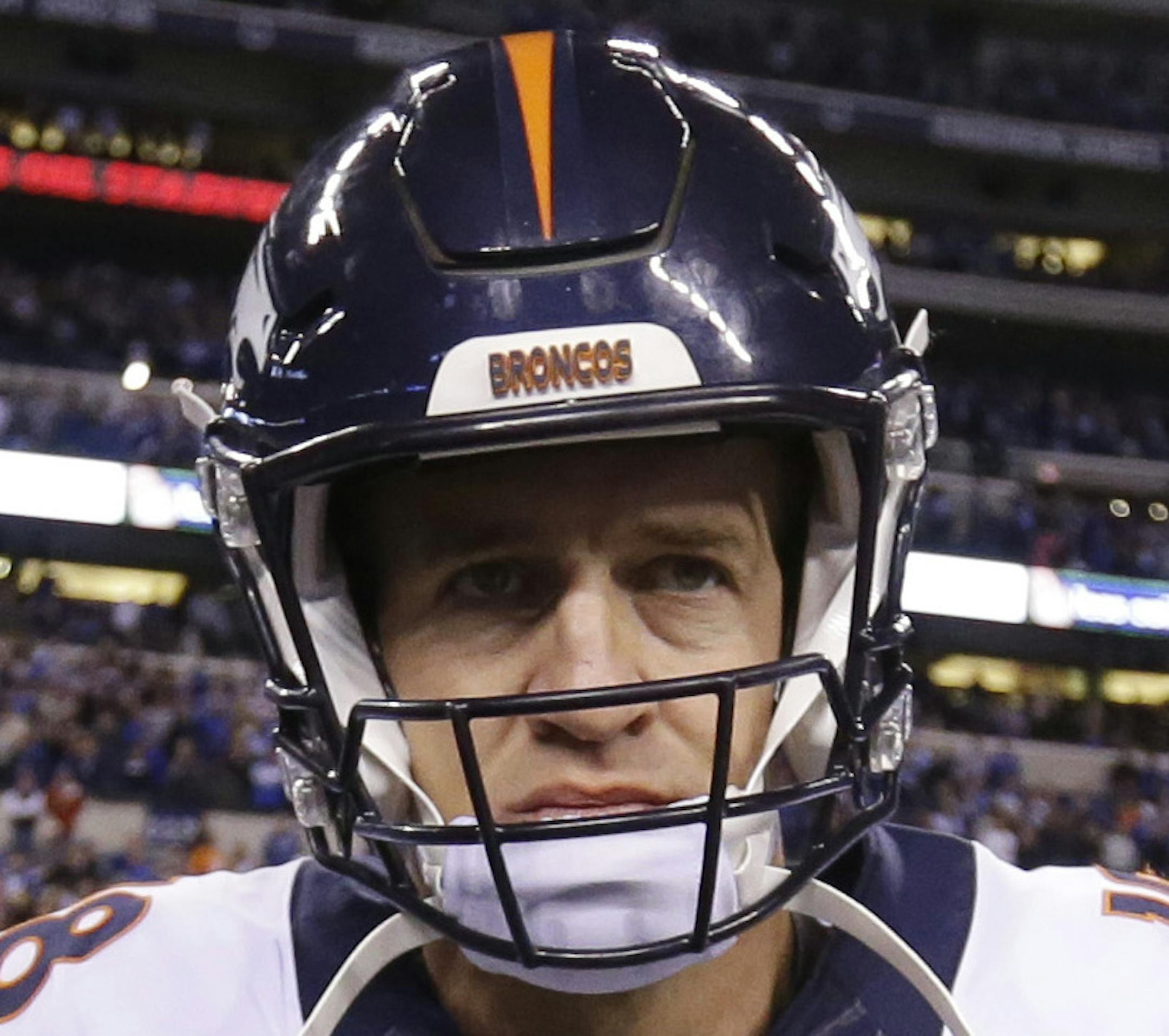 Denver Broncos' Peyton Manning (18) walks onto the field following an NFL football game against the Indianapolis Colts, Sunday, Nov. 8, 2015, Indianapolis. The Colts won 27-24. (AP Photo/Michael Conroy)