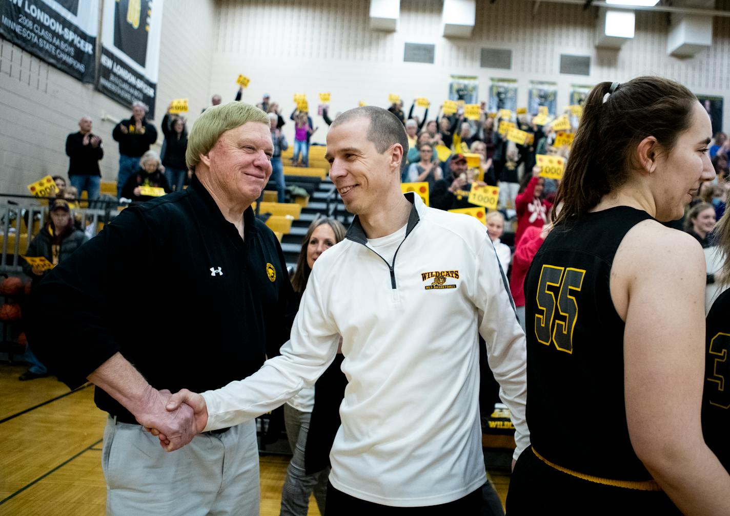 New London-Spicer varsity girls head coach Mike Dreier, at left, is congratulated by son and assistant coach Joey Drier after Mike won his 1,000th basketball game in New London on Friday, Jan. 28, 2022.