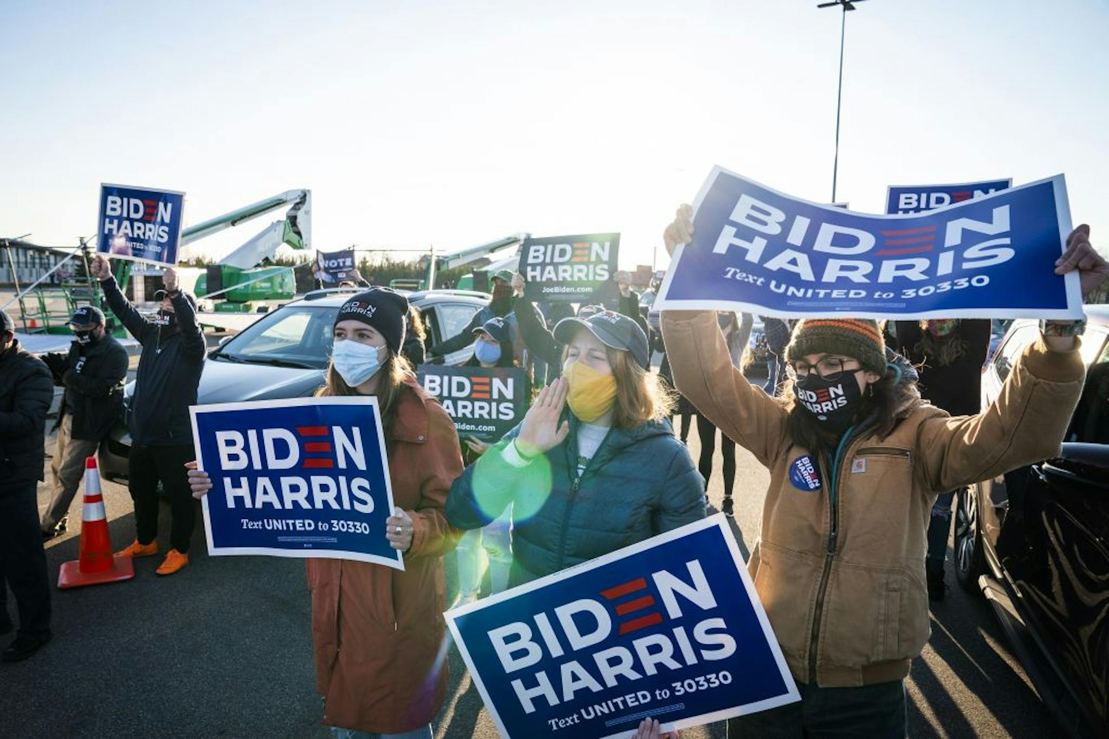 Supporters of former Vice President Joe Biden listened as he spoke during a drive-in campaign event in Falcon Heights.