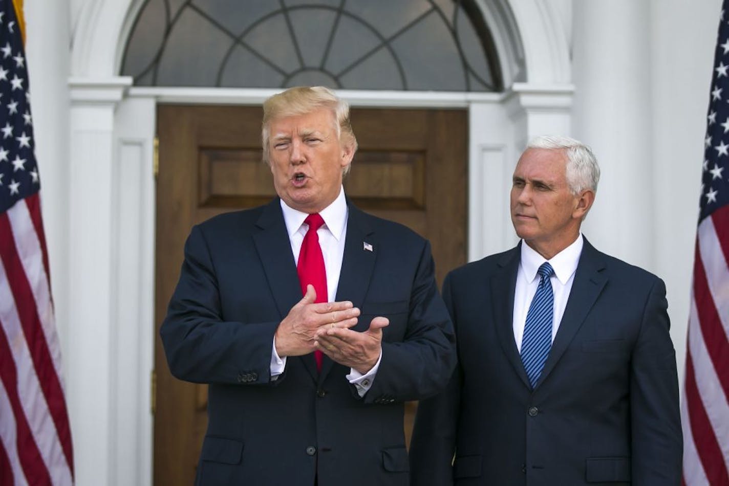 President Donald Trump speaks to reporters at Trump National Golf Club in Bedminster, N.J., on Thursday. Trump refused to back down Thursday from his threat to rain down "fire and fury" on North Korea if it endangers the United States, despite bipartisan criticism and he argued that perhaps he was not tough enough. At right is Vice President Mike Pence.