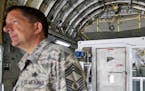 CORRECTS TO C-17 FROM B-17 - A medevac biocontainment unit is displayed aboard a C-17 military transport plane at Dobbins Air Force Reserve Base durin