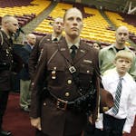 Trooper cadet and class speaker Tesa McLeod was accompanied by her sons Brysen, 9, Bosten, 10, not shown, and her husband Mike before she was given he