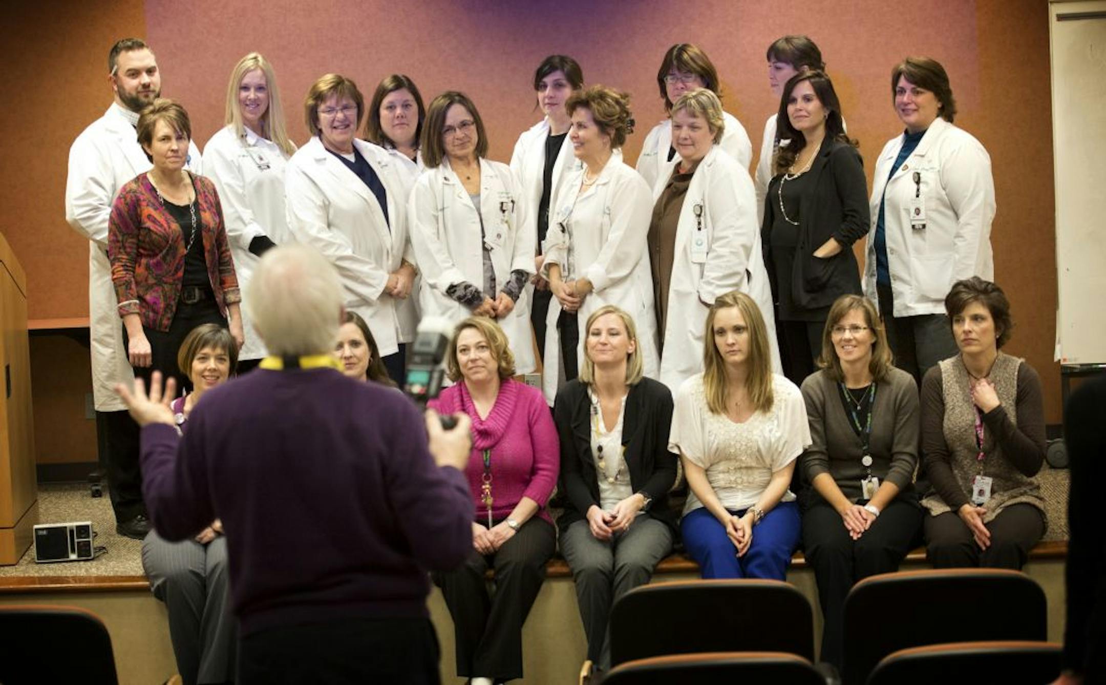 Dusty Powers is in a new role as patient care coordinator for Allina Health's Virginia Piper Cancer Institute. Healthcare is a growing field and this new job description is a factor. So many new patient care coordinators have been added to the roles at Allina, they have regular meetings to help streamline the process. Here they all posed for a new group photo for an Allina photographer. Thursday, November 29, 2012.