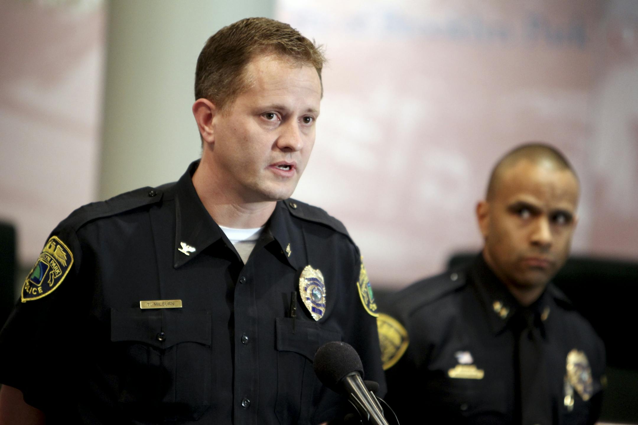 Brooklyn Park Police Inspector Todd Milburn answers questions about the morning's triple homicide during a press conference at Brooklyn Park City Hall April 9, 2012. At the time of the press conference, the names of the victims had not yet been released.