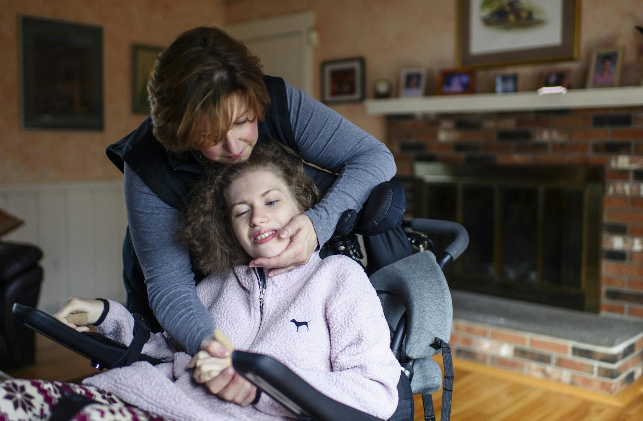 **EMBARGO: No electronic distribution, Web posting or street sales before 2:59 a.m. ET Tuesday, July 7, 2020. No exceptions for any reasons. EMBARGO set by source.** Monica Coenraads and her daughter, Chelsea Coenraads, who has Rett Syndrome, at their home in Trumbull, Conn., Nov. 14, 2019. Faced with illnesses that most scientists overlook and that have no known therapies, people are working on their own to find treatments for their children or themselves. (Monica Jorge/The New York Times)