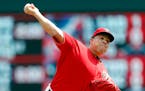 Minnesota Twins pitcher Bartolo Colon throws against the Arizona Diamondbacks in the first inning of a baseball game Sunday, Aug. 20, 2017, in Minneap