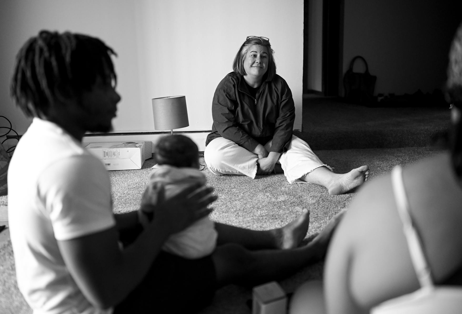 Carrie Crook, with Hennepin County's Parent Support Outreach Program (PSOP), caught up with Tre'Onna Williams, her partner Zaheim Barbar and their newborn in their soon-to-be furnished living room in Brooklyn Center.