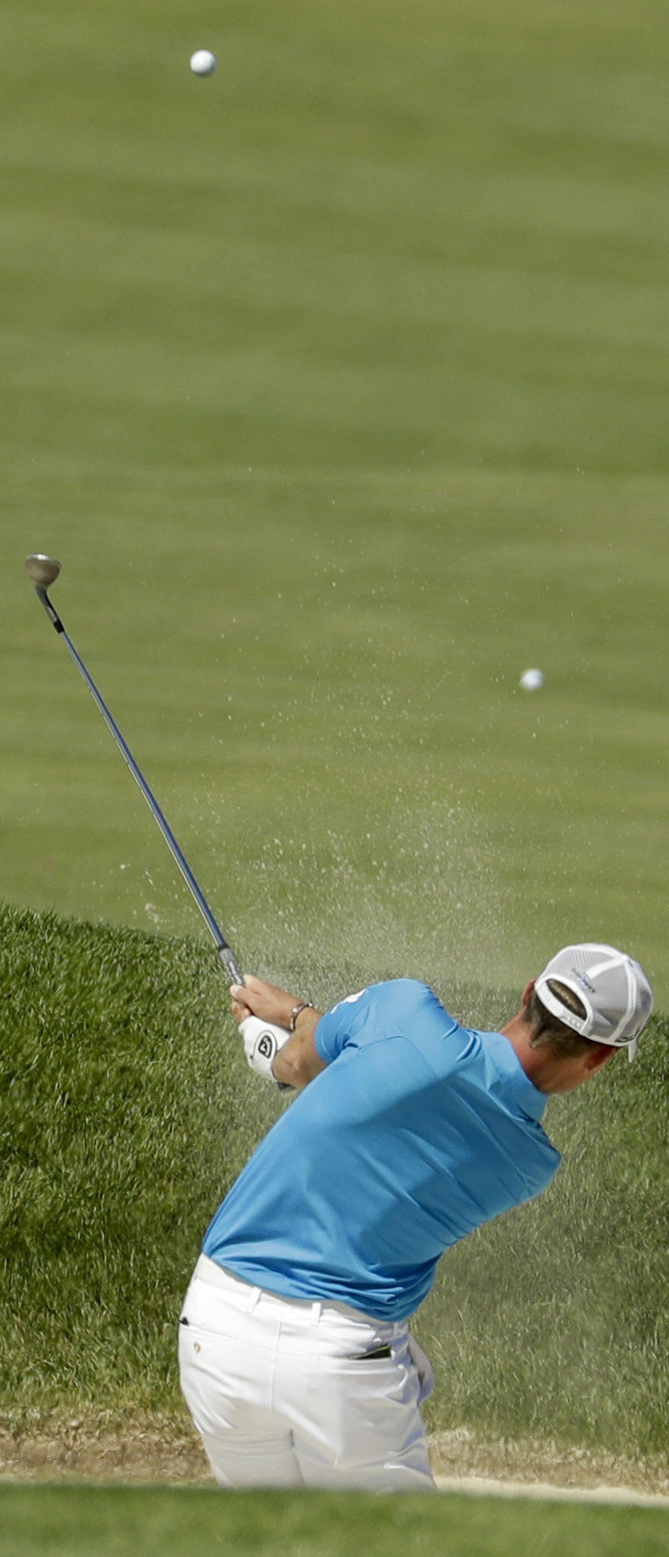Danny Willett, of England, hits out of the bunker on the 12th hole during a practice round for the U.S. Open golf championship at Oakmont Country Club on Tuesday, June 14, 2016, in Oakmont, Pa. (AP Photo/Charlie Riedel)