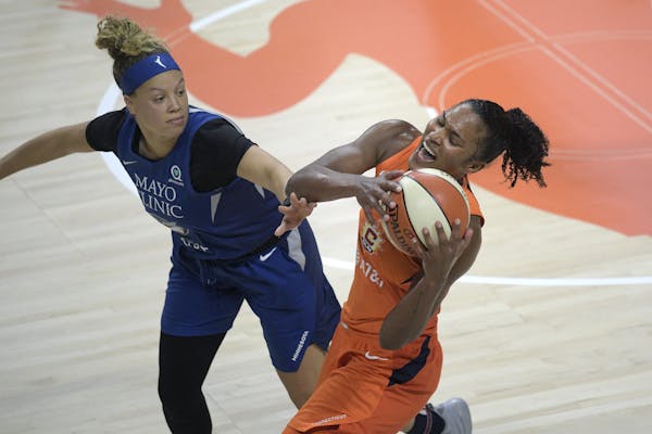Guard Rachel Banham (left, shown in a July game against Connecticut) helped the Lynx (14-8) secure the No. 4 seed in the WNBA playoffs and the single 
