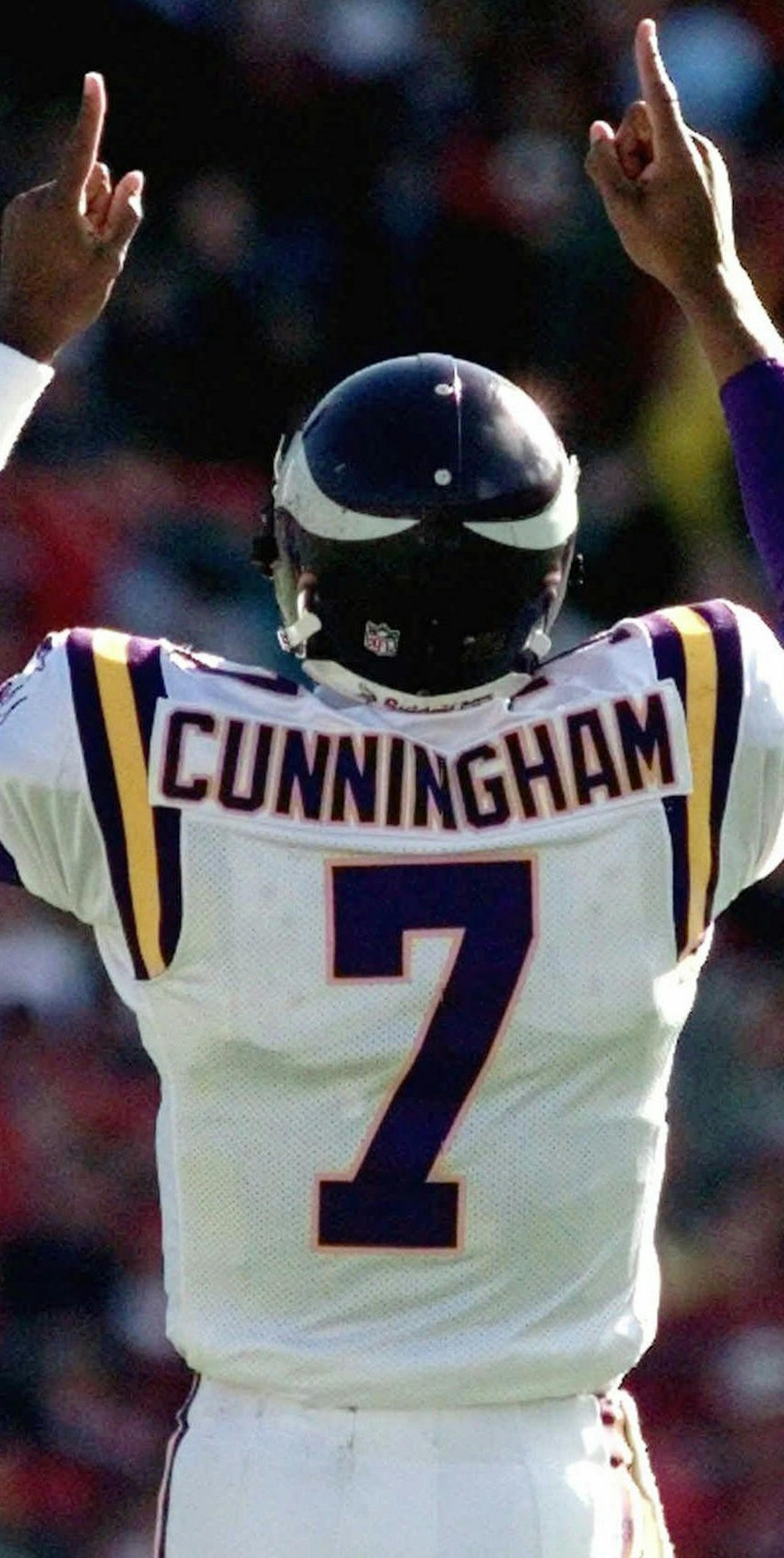 ADVANCE FOR WEEKEND EDITIONS JAN. 16-17--FILE--Minnesota Vikings Randall Cunningham celebrates a 68-yard touchdown by Vikings receiver Cris Carter against the San Francisco 49ers at 3Com Stadium in San Francisco in this Jan. 3, 1998 photo. After all those years of unfulfilled promise in Philadelphia, one long year of soul-searching and one season as a little-used backup, Cunningham is about to play for the NFC championship for the first time in his life. The Vikings play the Atlanta Falcons on S